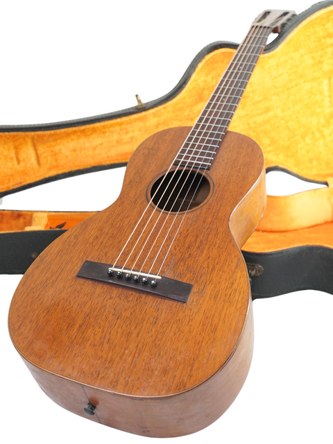 1928 Martin 2-17 Flat Top guitar with a stunning wooden body, neatly stored in its case.