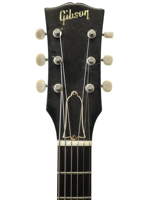 1961 Gibson Les Paul Custom Jumbo, a timeless piece of music history, known for its iconic sound and elegant design.