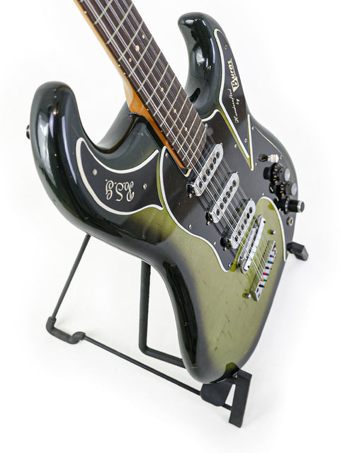 1964 Burns Double Six 12-string guitar showcasing a stylish black body paired with a bold green headstock.