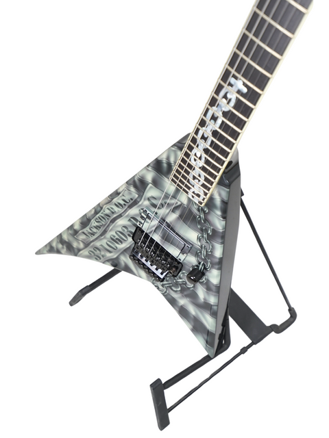 A Jackson Custom Shop Randy Rhoads RR1 guitar from 2006, highlighted by a bold black and white logo, is displayed prominently.