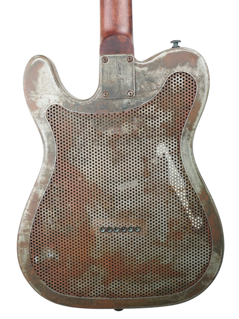 A James Trussart Steelcaster guitar featuring a sleek metal body and a warm wooden back, crafted in the USA, 2006.
