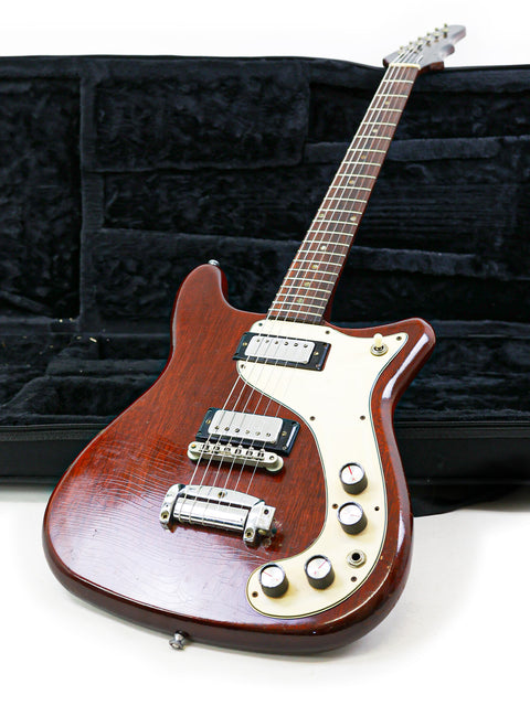 A classic 1966 Epiphone Wilshire guitar nestled in its case on a bright white background.