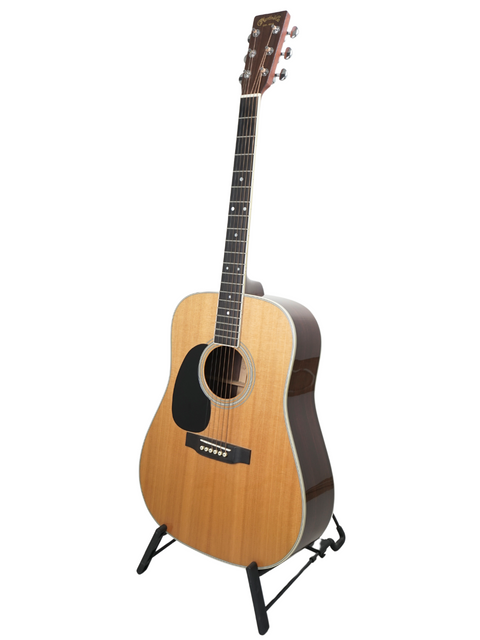 A left-handed Martin D-35 guitar from 2009 displayed on a stand against a clean white background.