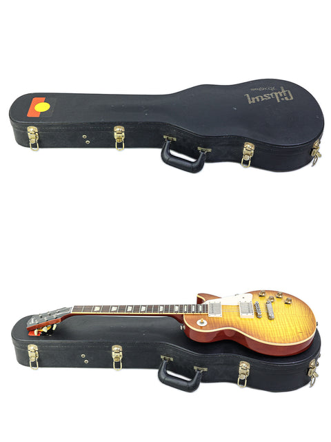 A pair of Gibson Les Paul '59 Reissue guitars, both featuring the same body shape and color, highlighting their vintage appeal.
