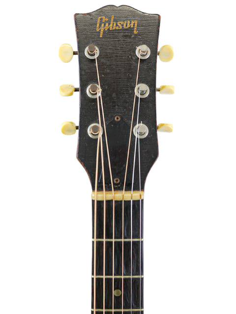 A stunning 1961 Gibson J-45 electric guitar, reflecting vintage charm and American craftsmanship from the 1953 model.