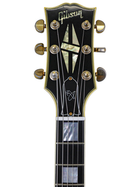 A stunning Gibson Custom Jimmy Page Les Paul Custom 467/500 from 2008, highlighting its iconic shape and rich finish.