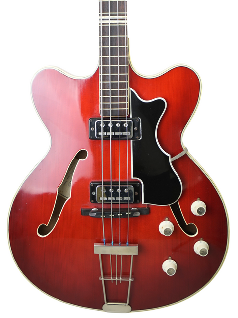 A vintage Hofner Verithin Bass from 1961, featuring a red guitar with a black body and a white pickguard.