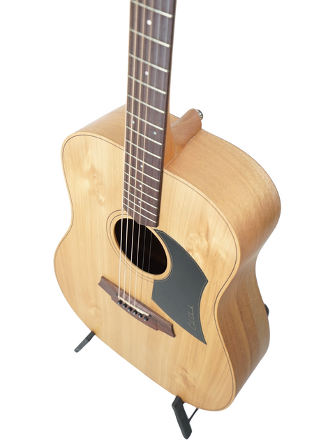 An acoustic guitar on a stand against a white background.
