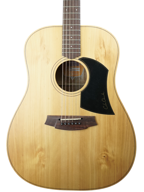 An acoustic guitar with light wood finish and black pickguard against a white background.