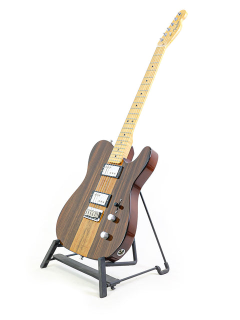 An electric guitar on a stand against a white background.