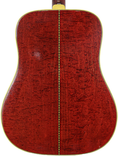 Back of a 1968 Gibson Dove acoustic guitar, displaying a rich red finish that captures its vintage charm and quality.
