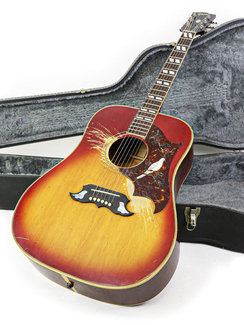 Beautiful sunburst-finished 1968 Gibson Dove guitar in its case, representing timeless elegance and craftsmanship.