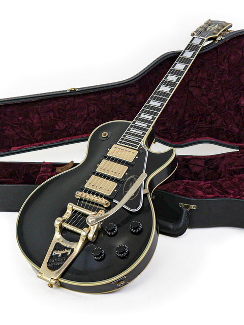 Black Les Paul Custom guitar by Gibson, gold hardware, in a case, part of the limited edition 467/500 from 2008.