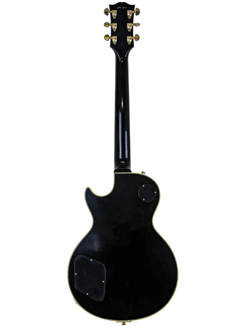 Black electric guitar on a white background, featuring the Gibson Custom Jimmy Page Les Paul Custom 467/500 from 2008.