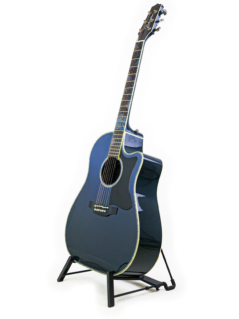 Blue acoustic guitar displayed on a stand, featuring the Takamine LTD2021 Limited Edition "Blue Rose" from Japan, 2021.