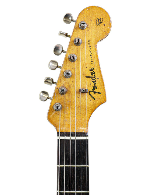 Check out this vintage 1963 Fender L-Series Stratocaster, beautifully refinished and ready to rock in the photo!