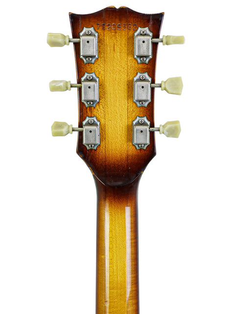 Close-up image of the headstock of a 1979 vintage Gibson Les Paul Standard acoustic guitar, emphasizing its iconic style.