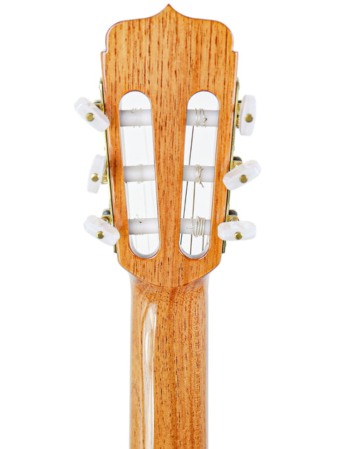 Close-up of a José Ramírez Estudio 3 classical guitar, showcasing its rich wooden body and intricate craftsmanship.