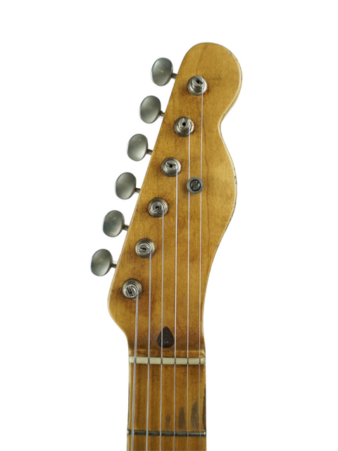 Close-up shot of a guitar headstock from Nacho Guitars' 50s Stratocaster, featuring a minimalist white background.