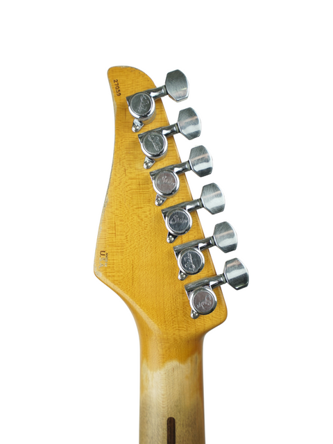 Detailed view of a Suhr Classic T guitar headstock, showcasing a single pickup and a vintage butterscotch color.