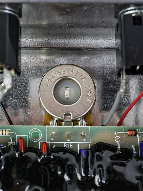 Detailed view of a circuit board from a 1999 Klon Centaur Silver, highlighting wires and electronic components.