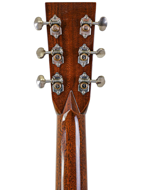 Detailed view of the headstock from a 2019 Martin Custom Shop 000-42 acoustic guitar made of Guatemalan rosewood.