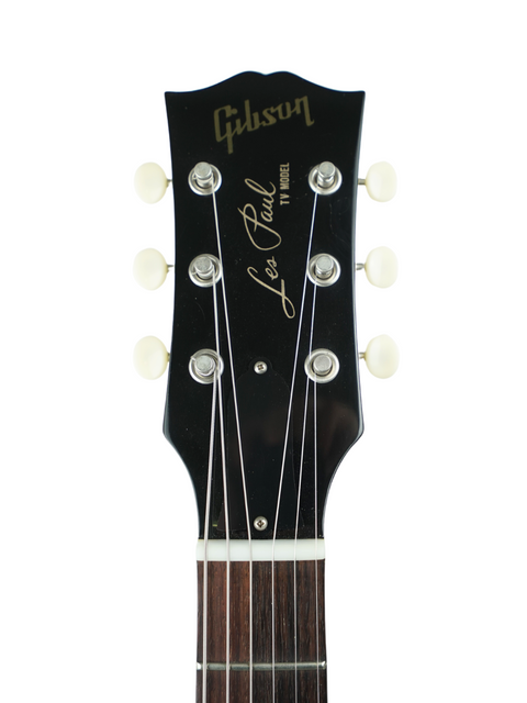 Detailed view of the headstock from a 2020 Gibson Custom Les Paul Jr. in TV Yellow, highlighting the "Falcon" name.