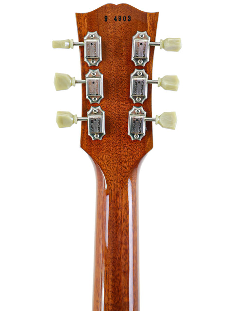 Detailed view of the neck of a Gibson Custom Shop 1959 Reissue Les Paul R9 acoustic guitar, highlighting its elegant design.