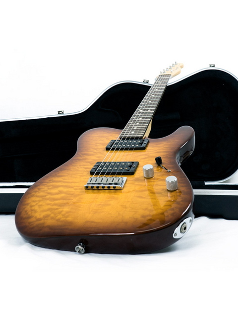 Electric guitar with a sunburst finish leaning against an open black case.