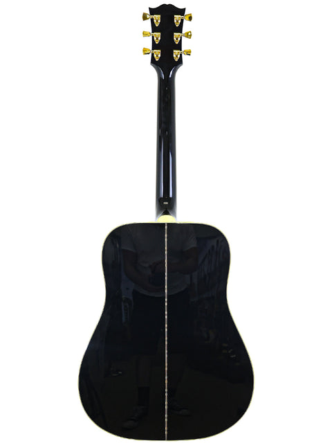 Elegant black guitar with a gold pickguard, part of the 2023 Gibson Custom Shop Elvis Dove collection from the USA.