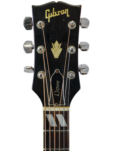 Headstock of a 1968 Vintage Gibson Dove guitar, prominently displaying the classic Gibson logo.