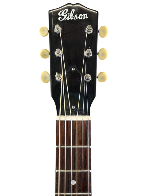 Headstock of a Gibson 30s L-00 True Vintage electric guitar against a clean white background.