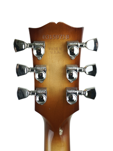 Headstock of a Gibson Custom ES-137 Classic electric guitar from 2009, featuring four control knobs.