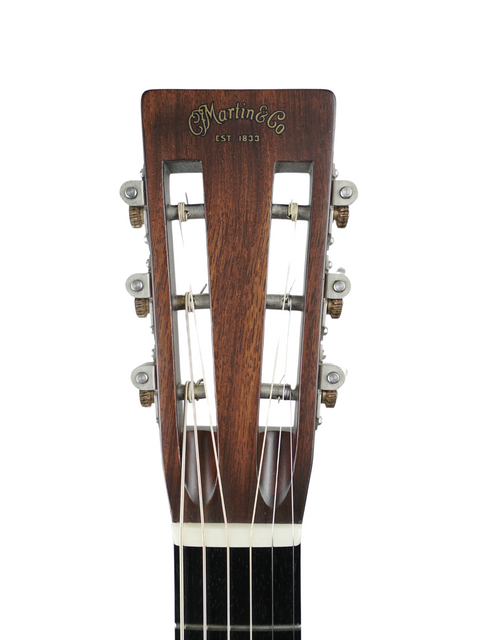 Headstock of a Martin 0-28VS acoustic guitar, showcasing its wooden body and elegant craftsmanship from USA, 2011.