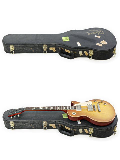Image of two guitars in cases, highlighting a Gibson Custom Shop LPR-8 1958 Les Paul Reissue, USA, 2011 model.