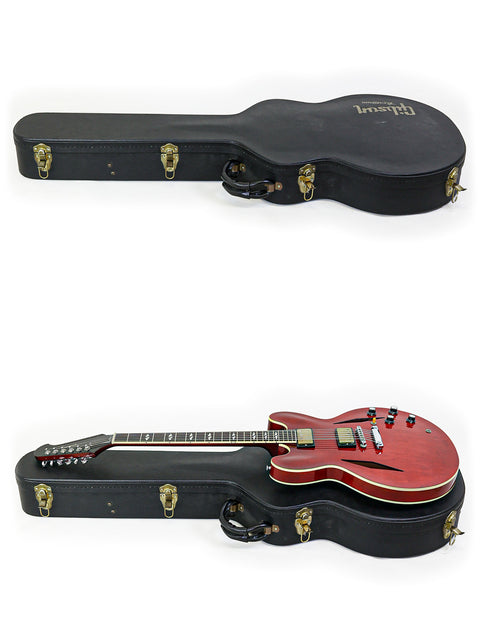 Image of two guitars with their cases on a white background, showcasing a 2009 Gibson Custom Shop Trini Lopez model.