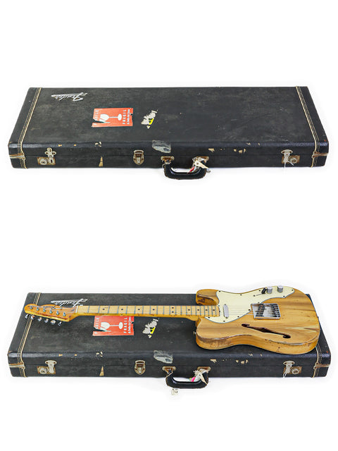 Inside a case, two guitars are showcased, featuring a classic 1971 Fender Telecaster Thinline.