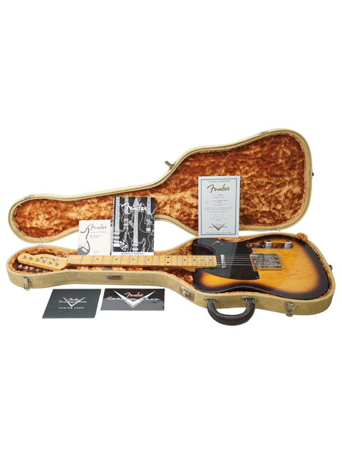 Inside a guitar case, a Fender Custom Shop 50's Telecaster NOS rests, exemplifying timeless style and expert craftsmanship.