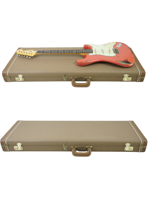 Inside a guitar case, a red Fender Custom Shop '63 Michael Landau Stratocaster Relic from 2015 is prominently displayed.