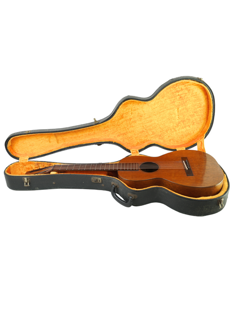 Inside an open case lies a 1928 Martin 2-17 Flat Top guitar, a stunning piece of vintage craftsmanship and musical heritage.