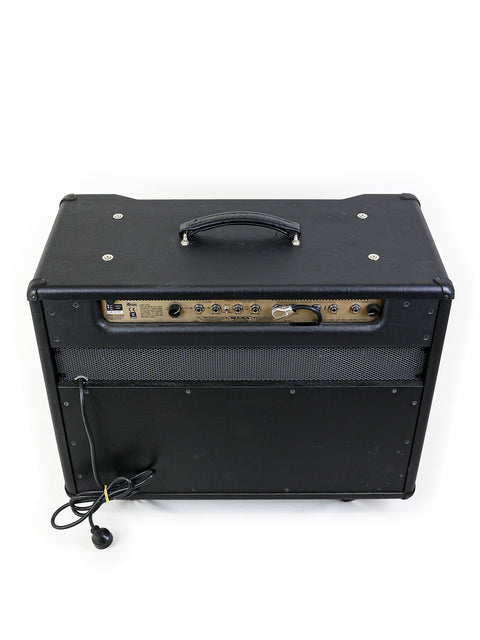 Mesa Boogie Stiletto Ace 2x12" combo amplifier featuring a black exterior, stylish cover, and striking gold trim.