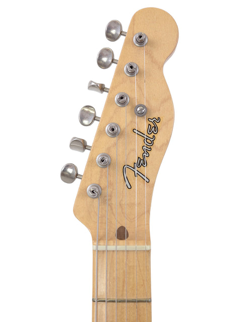 Natural finish Fender American Standard Stratocaster M-1, highlighting its elegant body and classic features.
