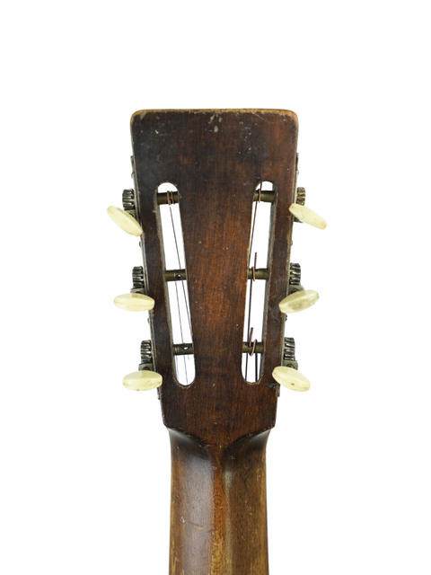 Original 1930s Gibson guitar, a top-end vintage piece, highlighting its unique style and rich musical history.