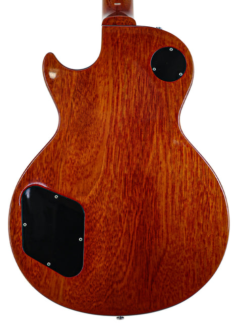 Rear side of a 2004 Gibson Custom Shop 1959 Reissue Les Paul R9 electric guitar showcasing its wooden body.