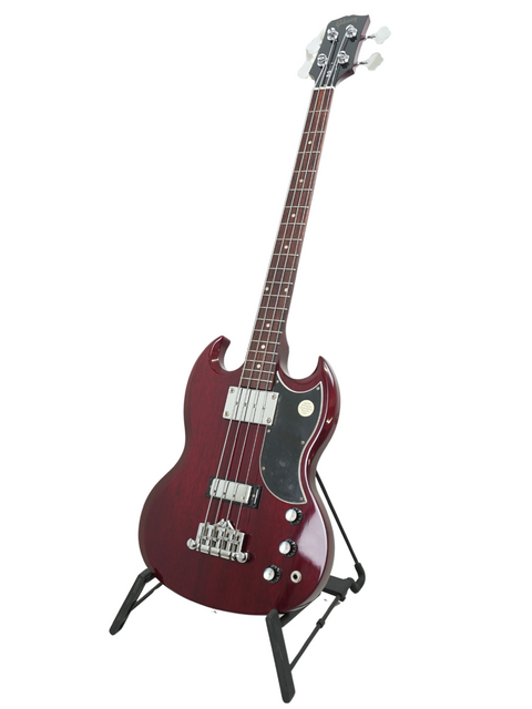 Sleek red electric bass guitar on a stand, showcasing the 2005 Gibson SG Standard Reissue, perfect for your music collection.