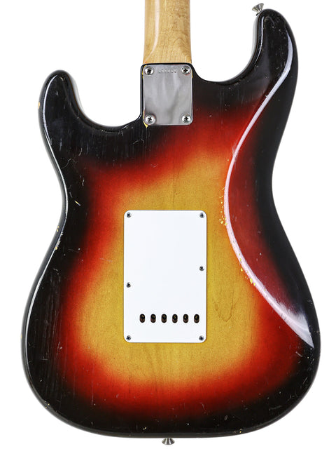 Stunning sunburst finish on a vintage 1963 Fender Stratocaster, a true gem for guitar enthusiasts and musicians alike.