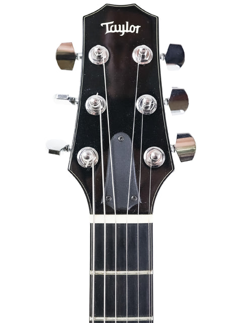 Taylor D-18E electric guitar, USA-made in 2007, highlighting its solid body and beautiful craftsmanship.