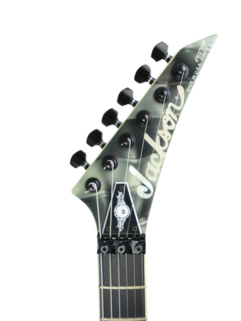 The image features a Jackson Custom Shop Randy Rhoads RR1 guitar with a striking black and white logo, made in 2006.