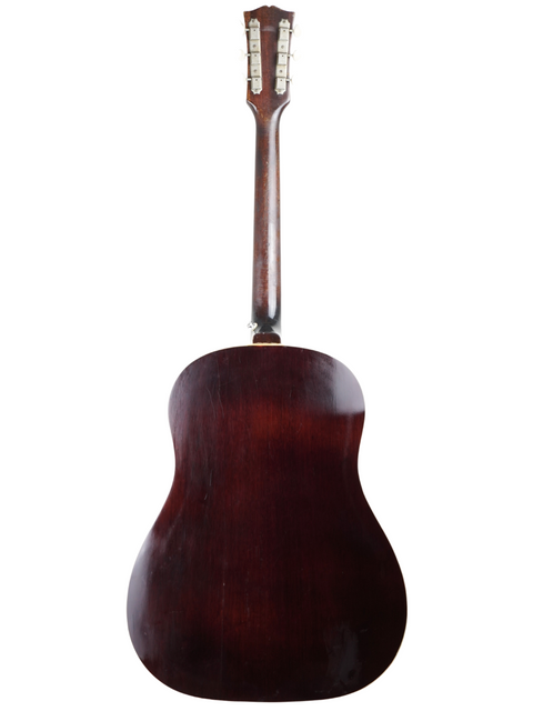 The wooden back of a 1968 Gibson J-50 acoustic guitar, highlighting its vintage craftsmanship.
