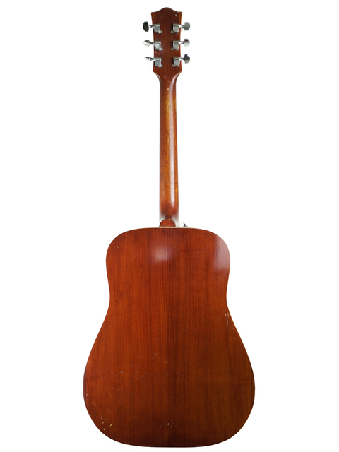 The wooden back of a 1972 Maton FG100 acoustic guitar, highlighting its vintage charm and craftsmanship.